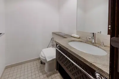 a bathroom with a sink and a toilet at Durrani Homes - Modern Living 3br with Burj Khalifa and Fountain View - third room without partition in Dubai