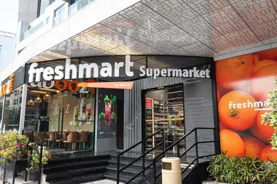 a store with a sign on the front of it at Gracious 1BR in Condor Marina Star, Dubai Marina in Dubai