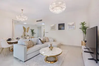 a living room with a couch and a table at Classy 2BR Apt in Shams1 Panoramic view in JBR in Dubai
