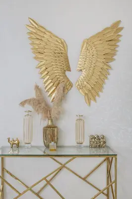 a table with two wings on the wall at Classy 2BR Apt in Shams1 Panoramic view in JBR in Dubai