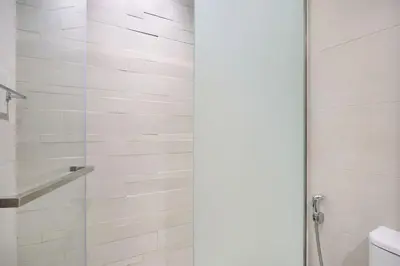 a bathroom with a shower with a glass door at Elegant Cozy Stu Luxury Stay 10 Min Dubai Mall in Dubai