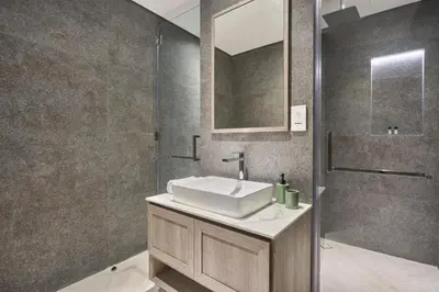 a bathroom with a sink and a shower at Chic-1BROxford Terrace 2 Luxuriously Furnished in Dubai
