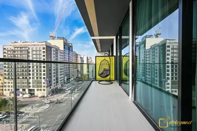 a balcony of a building with a view of a street at Stunning 1BR in JVC Binghatti Amber by Deleguest in Dubai