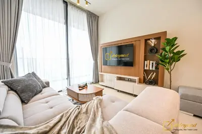 a living room with a couch and a tv at Stunning 1BR in JVC Binghatti Amber by Deleguest in Dubai