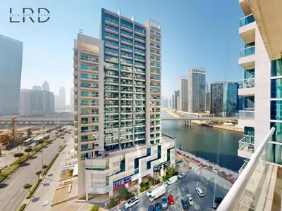 an aerial view of a city with tall buildings at Charming 1BR Apartment with Canal View in Business Bay in Dubai