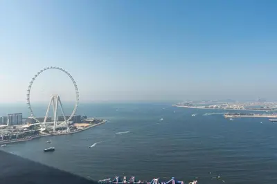 an aerial view of a ferris wheel in the water at King 2 Bedroom Jumeirah Beach & Dubai Eye Views in Dubai