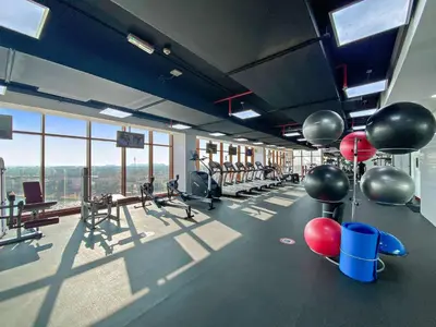 a gym with a lot of exercise equipment and balloons at Silkhaus Seaside Studio in Palm Views West Tower in Dubai