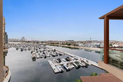 a group of boats docked in a marina at Silkhaus Seaside Studio in Palm Views West Tower in Dubai