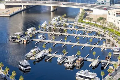 a group of boats docked at a marina at Waves - Tranquil Waterfront Living 2B Retreat With Balcony in Dubai