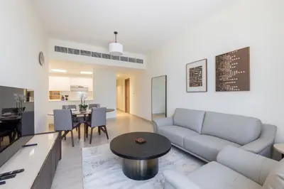a living room with a couch and a table at Partial Canal View, Business Bay in Dubai