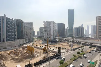 a view of a city with a construction site at Premium Apartment, Right Infront of Canal in Dubai
