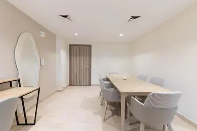 a dining room with a table and chairs at Premium Apartment, Right Infront of Canal in Dubai