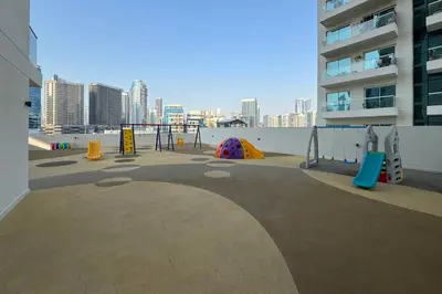 a playground in a building with a view of a city at Premium Apartment, Right Infront of Canal in Dubai