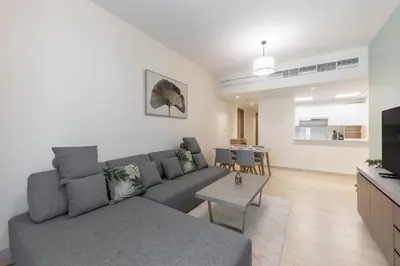 a living room with a couch and a table at Partial Canal View, Business Bay in Dubai