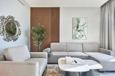 a living room with two couches and a table at STAY BY LATINEM Luxury 1BR Holiday Home CVG 1410 Near Burj Khalifa in Dubai