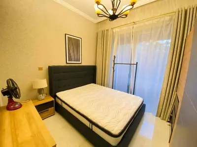 a small bedroom with a bed and a window at Dubai Luxury Apartments In a good place in Dubai