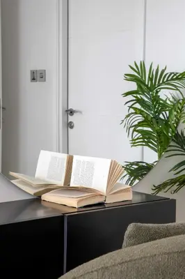 a stack of books sitting on a table at Frank Porter - Torch Tower in Dubai