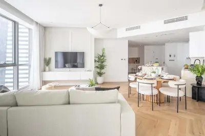 a living room with a white couch and a table at Frank Porter - Torch Tower in Dubai