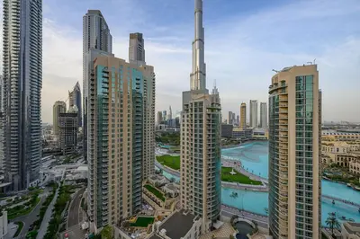 an aerial view of a city with tall buildings at Luxury Apartment with Full Burj & Fountain Views in Dubai