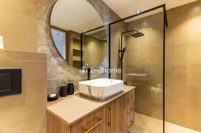 a bathroom with a sink and a mirror at Stylish 2Bedroom in DIFC Dubai Newly Furnished in Dubai