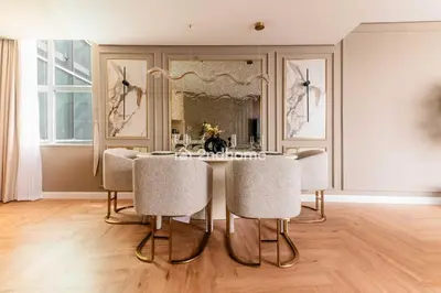 a dining room with a table and chairs at Stylish 2Bedroom in DIFC Dubai Newly Furnished in Dubai