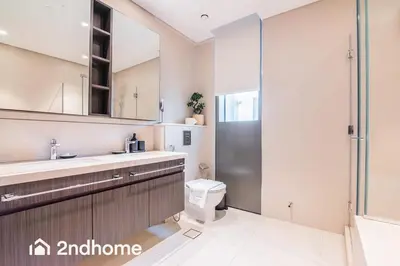 a bathroom with a toilet and a sink and a shower at Downtown Views 1 - Direct Access to Dubai Mall in Dubai