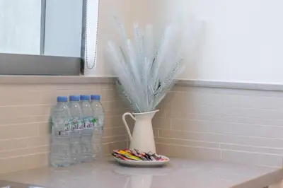 a vase of water and pens and a vase of pens at StayShort - Elegant 2BR in Dubai Marina - Luxury Awaits You in Dubai