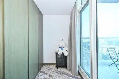 a teddy bear sitting on a table in a room at Luxury & Modern studio near Burj Khalifa in Dubai