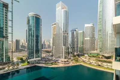 a view of a city skyline with a swimming pool at ZenStay - Haven of tranquility and luxury in Dubai