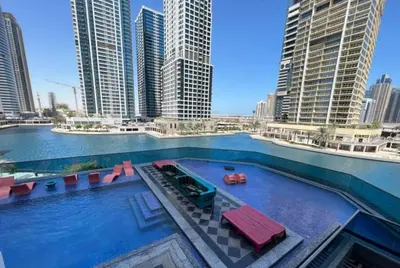 a swimming pool in a city with tall buildings at ZenStay - Haven of tranquility and luxury in Dubai