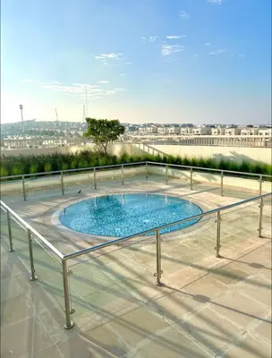 a swimming pool on the roof of a building at Vibrant studio - 15m to marina in Dubai