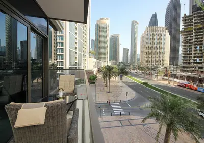 a balcony with a view of a city with buildings at Upscale2BR in Burj Crown Pool,Gym & Stunning Views in Dubai