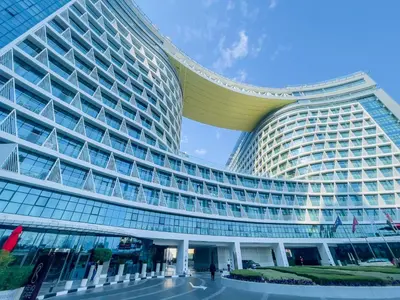 a large building with a lot of windows at Vserve Comfy & Relaxing 1 BDR Retreat At the Palm in Dubai