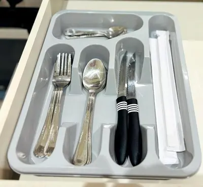 a tray with silver utensils sitting on a table at Luxury 1BR Apt Best view Infinity Pool Burj Khalifa with Balcony in Dubai
