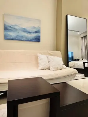 a hotel room with a bed and a mirror at Burj Khalifa View from your Balcony in Dubai