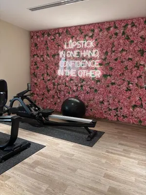 a room with a gym with a wall at Burj Khalifa View from your Balcony in Dubai