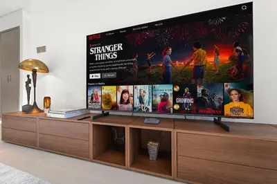 a large flat screen tv sitting on top of a entertainment center at Luxury 1BR in Downtown l Close to Dubai Mall in Dubai