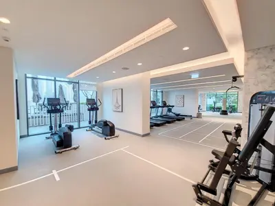 a gym with treadmills and exercise equipment in a room at Marina Vista - Airy One Bedroom in Dubai Marina in Dubai
