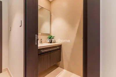a bathroom with a sink and a mirror at Luxurious Furnishing Direct Access to Dubai Mall in Dubai