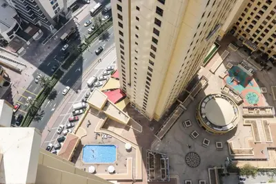 an overhead view of a city street with tall buildings at Livbnb - Spacious 2B in Shams with Marina View Walk to Beach in Dubai