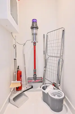 a room with a fire extinguisher and a fire hydrant at Stylish 1-BR Retreat with Sweeping Views in Palm Tower in Dubai