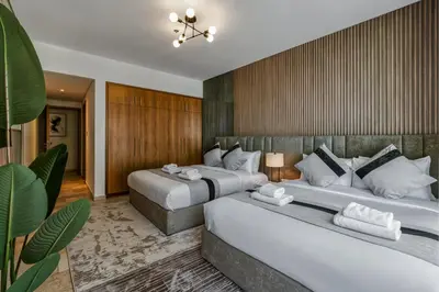 two beds in a hotel room with two bedsvisor at JBR Coastal Escape - Amazing Sea Views, Pool & State-of-the-Art Gym in Dubai