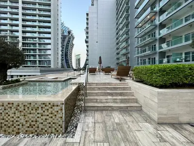 a stairway in a city with tall buildings at GuestReady - Luxe Comfort in Bussiness Bay in Dubai