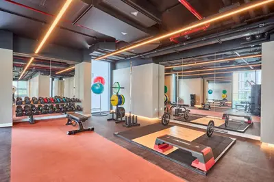 a gym with a lot of exercise equipment in it at STAY BY LATINEM Luxury 1BR Holiday Home CVG 2409 Near Burj Khalifa in Dubai