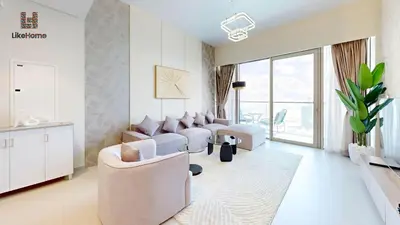 a living room with white furniture and a large window at Enjoy Best Burj Khalifa & Fountain Views From Balcony Luxury 2BR 3 Mins from Dubai Mall - Like Home in Dubai