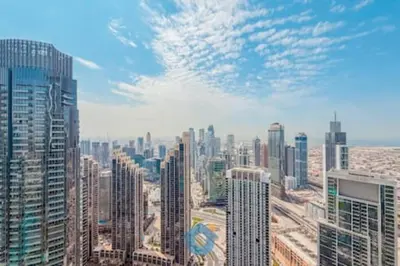 an aerial view of a city with tall buildings at Steps from Dubai Mall Enjoy Dubai Skyline from Balcony Luxury 2 Bedroom Like Home in Dubai
