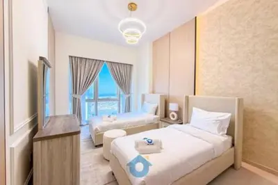 a hotel room with two beds and a large window at Next to Burj Khalifa & Dubai Mall - Enjoy Dubai Skyline Luxury 2BR Like Home in Dubai