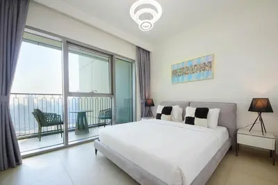 a bedroom with a large bed and a large window at Silk Valley - Luxury 2B with iconic Burj Khalifa views and walk to Dubai Mall in Dubai