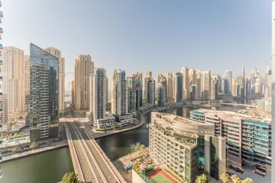 an aerial view of a city with a river and buildings at Terrace and Marina Views 1BR Near JBR, Ain Dubai and Major Landmarks, Zumurud, Dubai Marina by Deluxe Holiday Homes in Dubai