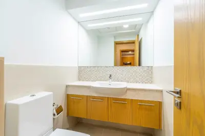 a bathroom with a sink and a mirror at Hideaway in Downtown in Dubai